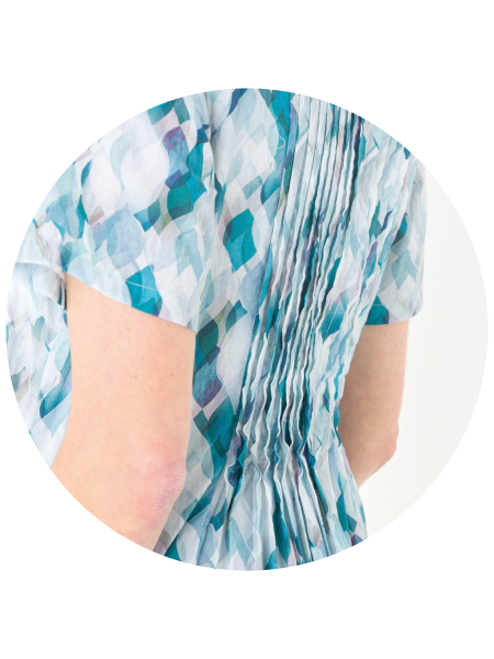 Close-up of a person wearing a blue and white patterned garment.